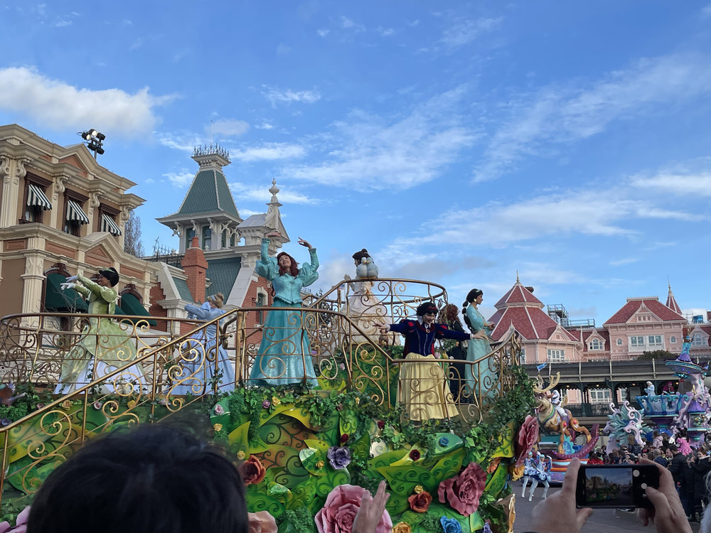Disney princess parade float at Disneyland Paris with families watching