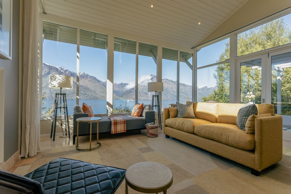 Elegant living room with panoramic views of Lake Wakatipu at Rosewood Matakauri