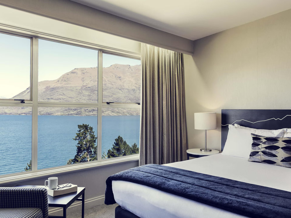 Spacious room with lake views at Mercure Queenstown Resort
