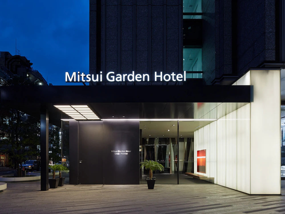 The well-lit facade of Mitsui Garden Hotel in Ginza