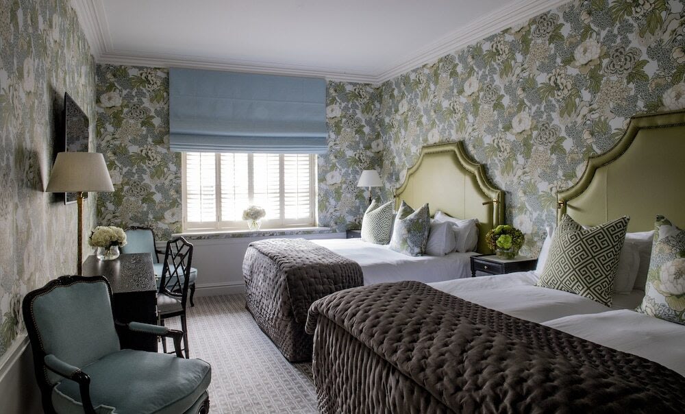 Bright and contemporary hotel room with two comfortable beds