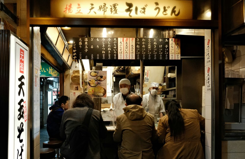 Small Japanese izakaya restaurant with chefs and counter seating | Photo Credit: Perry Merrity II on Unsplash