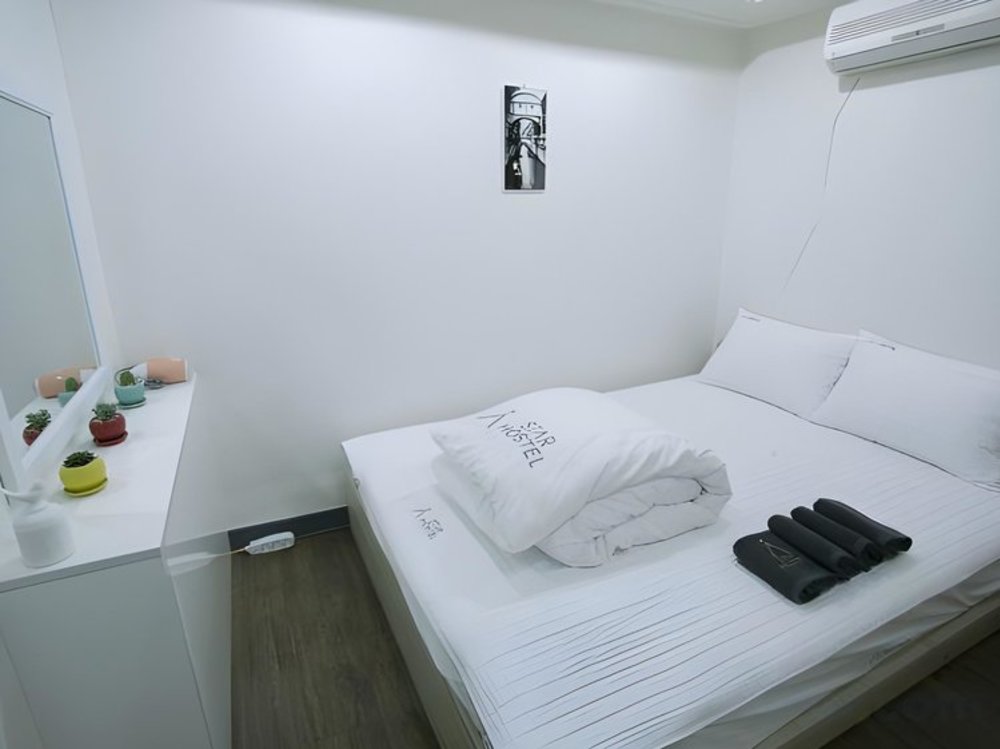 Simple double bedroom with vanity at Hostel Seoul South Korea