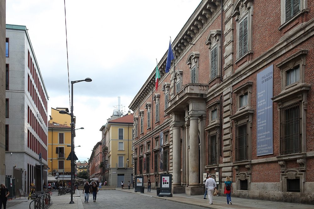 Cobblestone streets in Brera district, with the historic Palazzo di Brera
