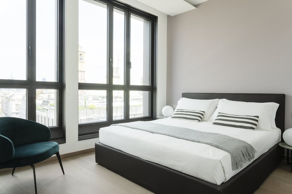 Modern bedroom at Milan Eleven by Brera Apartments with sleek design and city views
