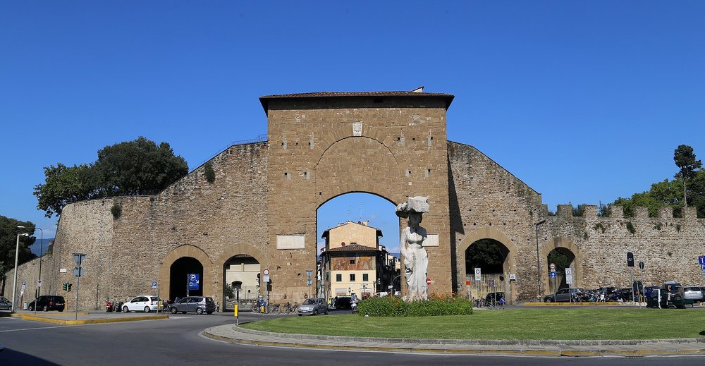 Porta Romana in Milan, an ancient city gate with a statue at the base