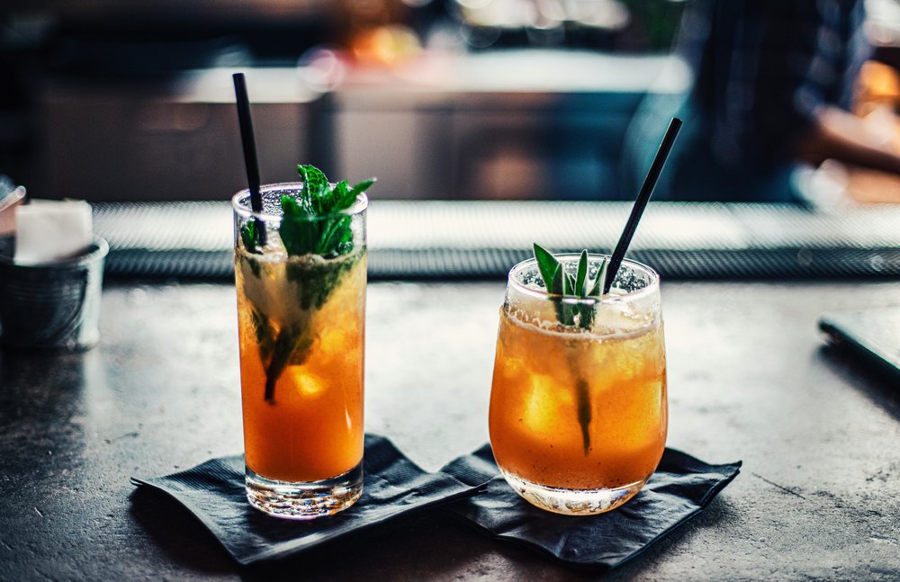Two handcrafted cocktails with mint garnish at a Melbourne bar