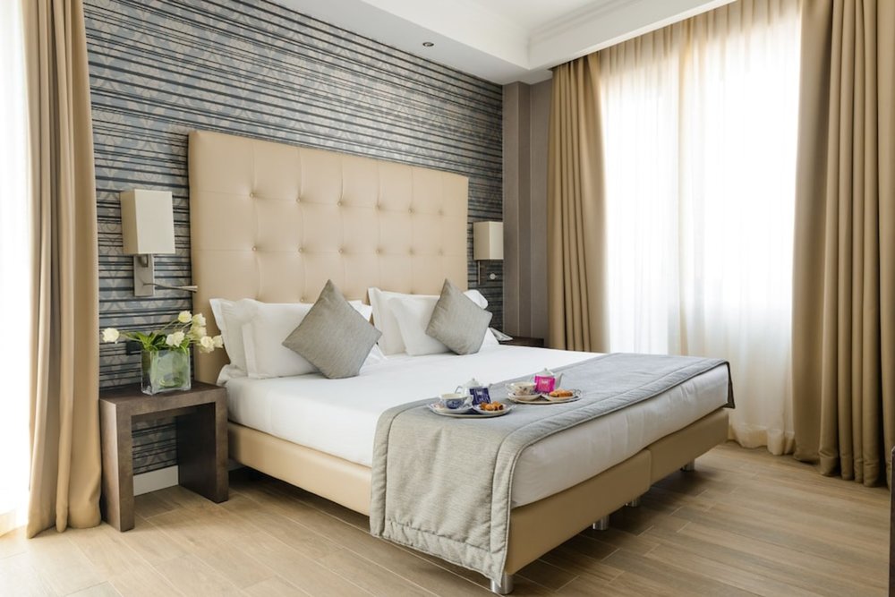 Bright and stylish room at Hotel Windsor Milano with cozy bed and contemporary design