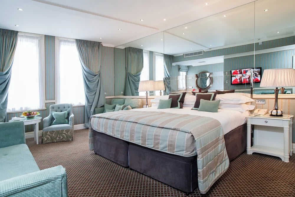 Family suite at The Rubens at the Palace, London, with luxurious decor and cozy furnishings