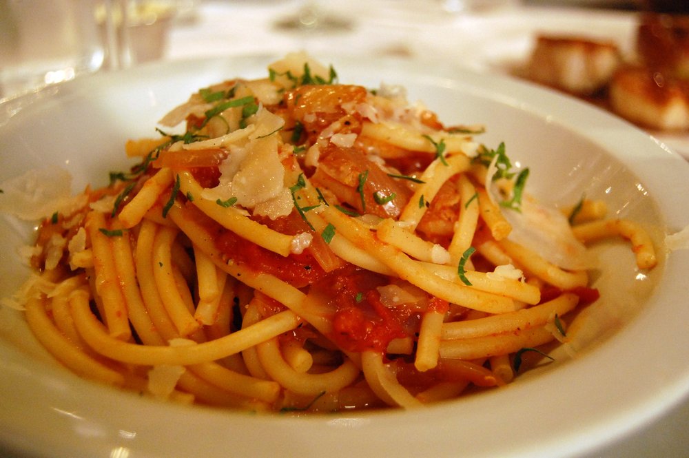 A serving of Amatriciana pasta with guanciale, and grated cheese | Photo Credit: Wikimedia Commons