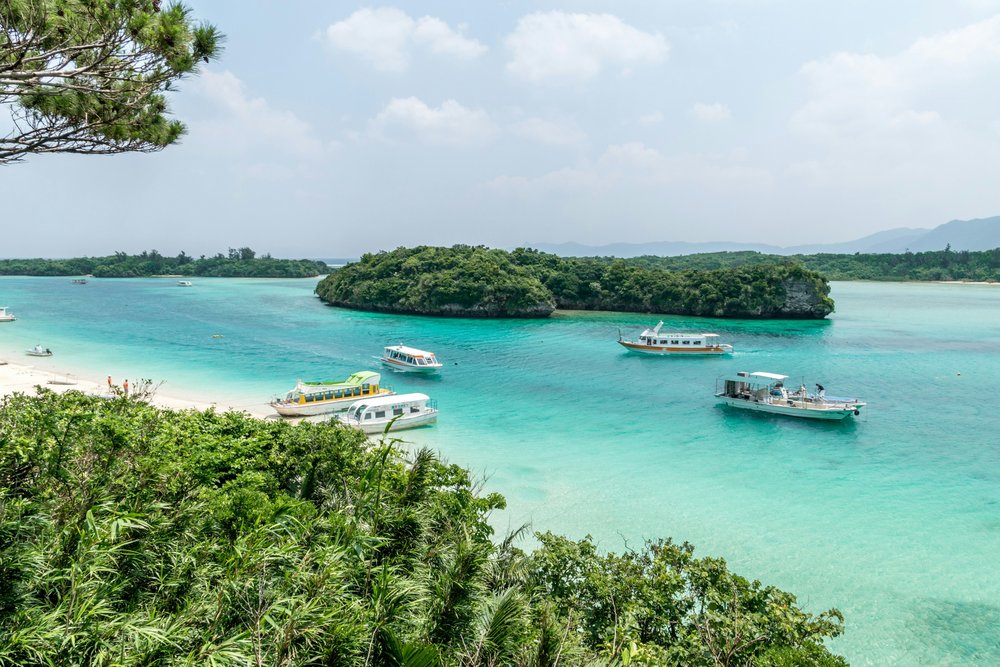 Turquoise waters and boats near Ishigaki Island | Photo Credit: Vladimir Haltakov on Unsplash
