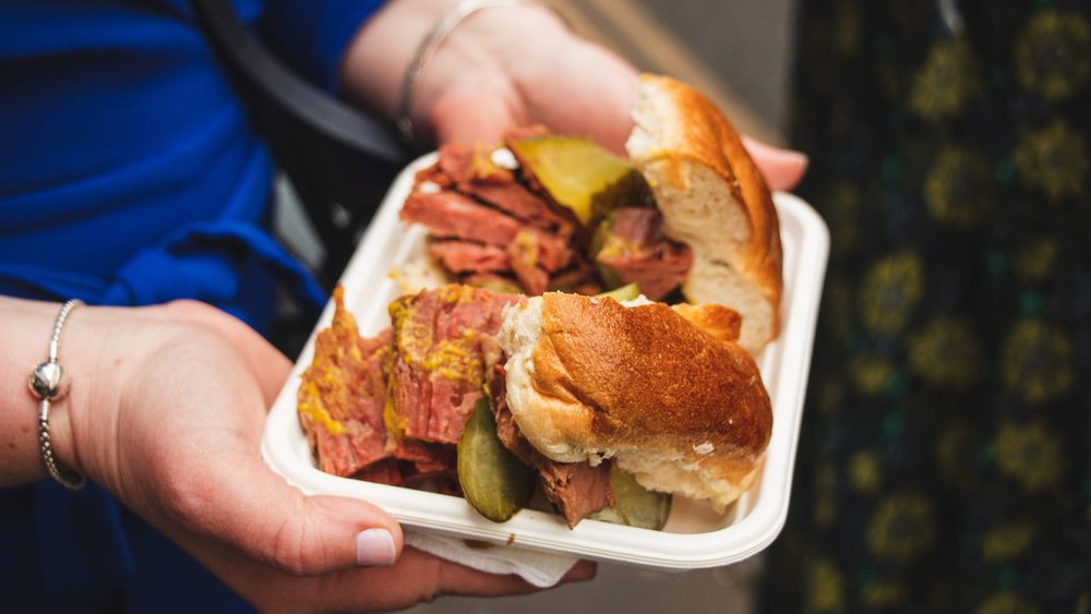 Salt beef bagel sandwich with mustard and pickles