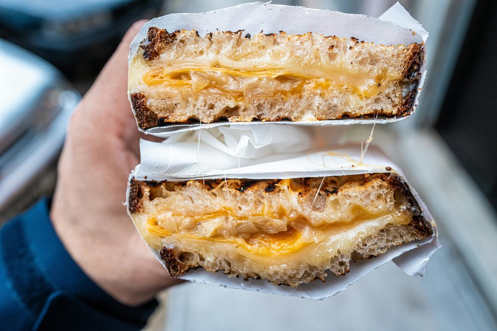 Close-up of gourmet grilled cheese sandwich with melted cheddar | Photo Credit: Anthony Rahayel on Pexels