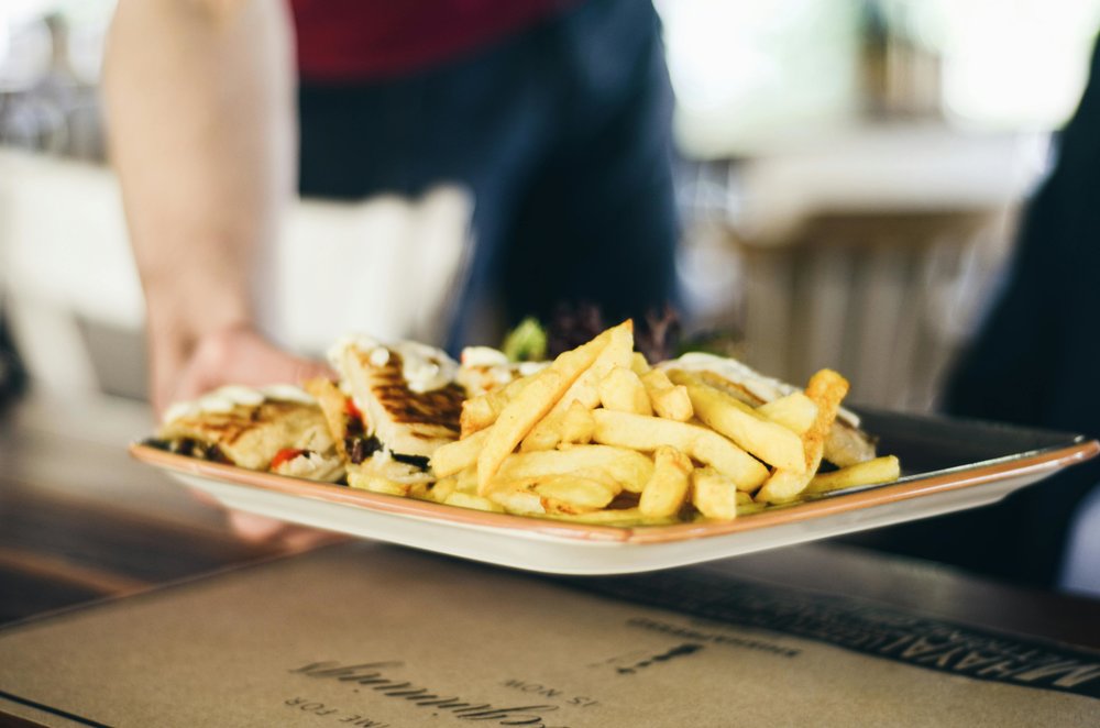 Plate of halloumi fries with dipping sauce and flatbread | Photo Credit: Gül Işık on Pexels