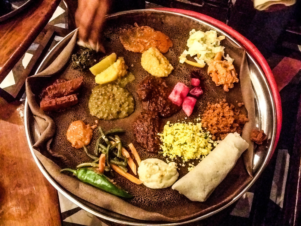 Traditional Ethiopian platter with injera and stews | Photo Credit: Wikimedia Commons