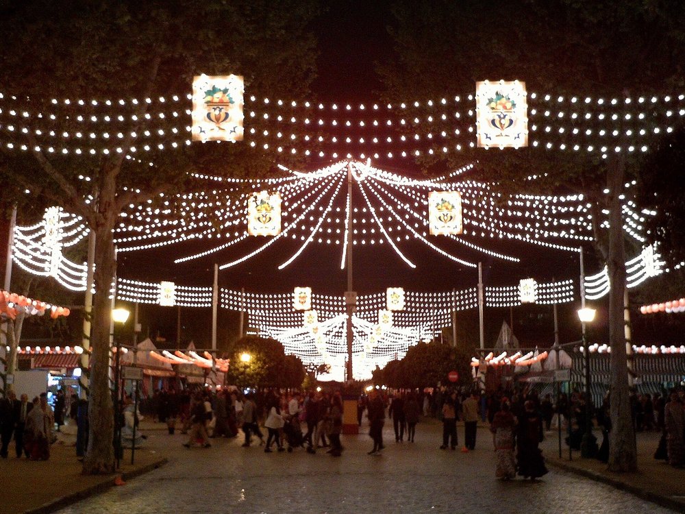 Seville Christmas Market with bright lights and holiday decorations in the evening