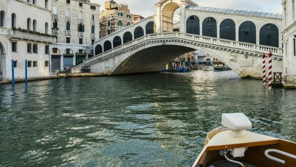 Scenic view of Rialto Bridge from the Grand Canal in Venice