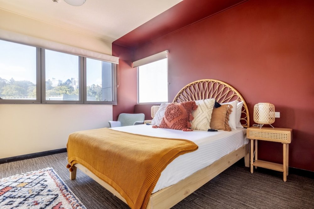 Modern private room with warm decor at Roamer Brisbane
