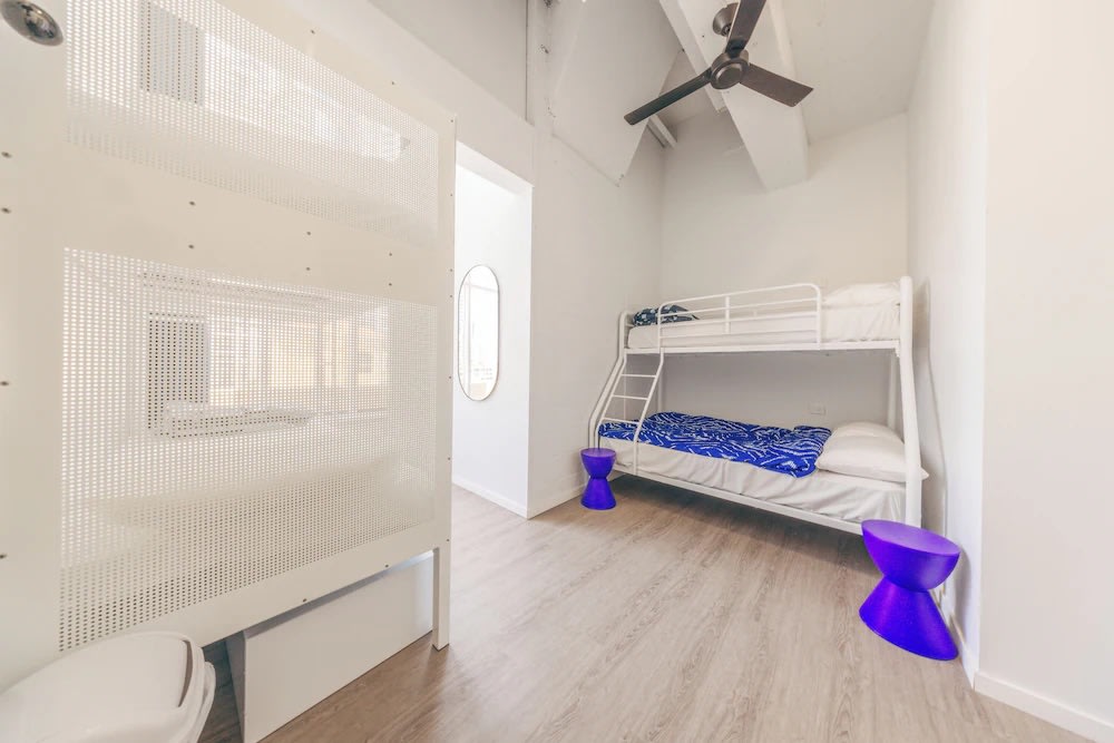 Clean white bunk bed room at Maze Backpackers Gold Coast