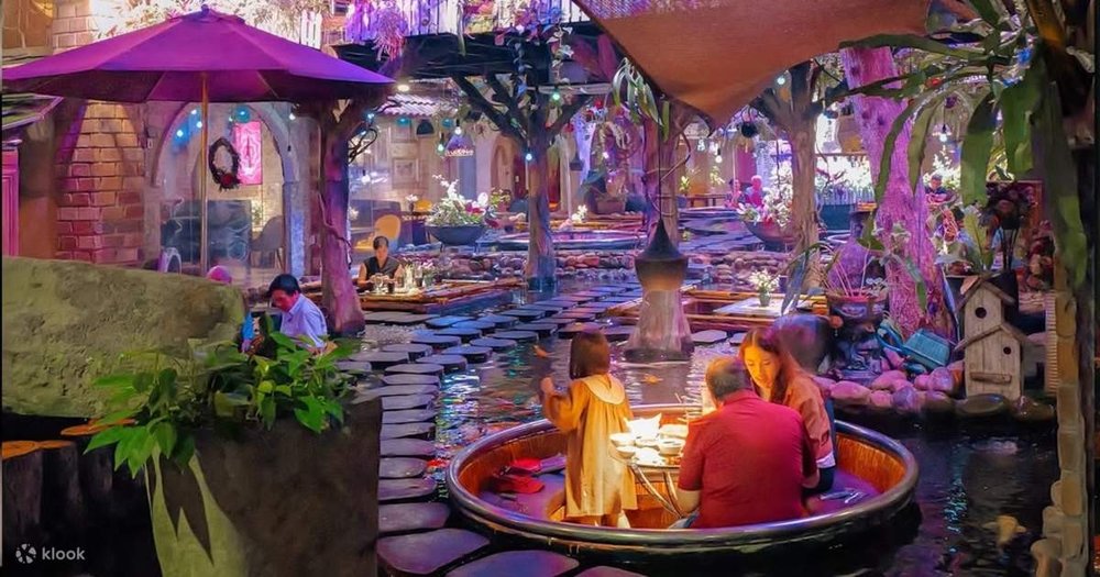 A cafe full of ponds that surround its guests while eating