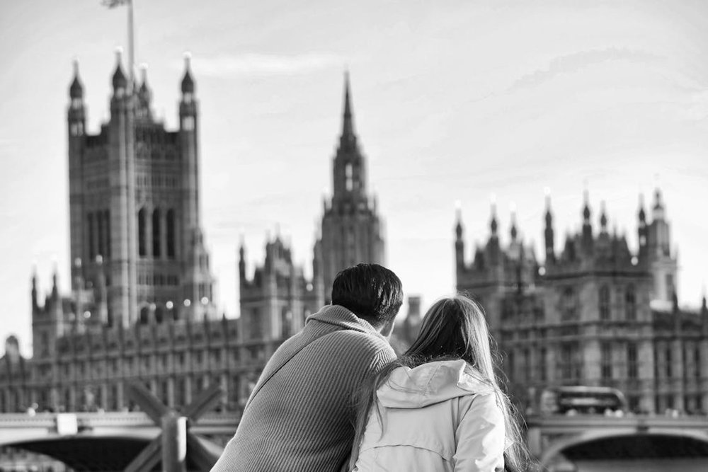 A couple viewing London’s House of Parliament