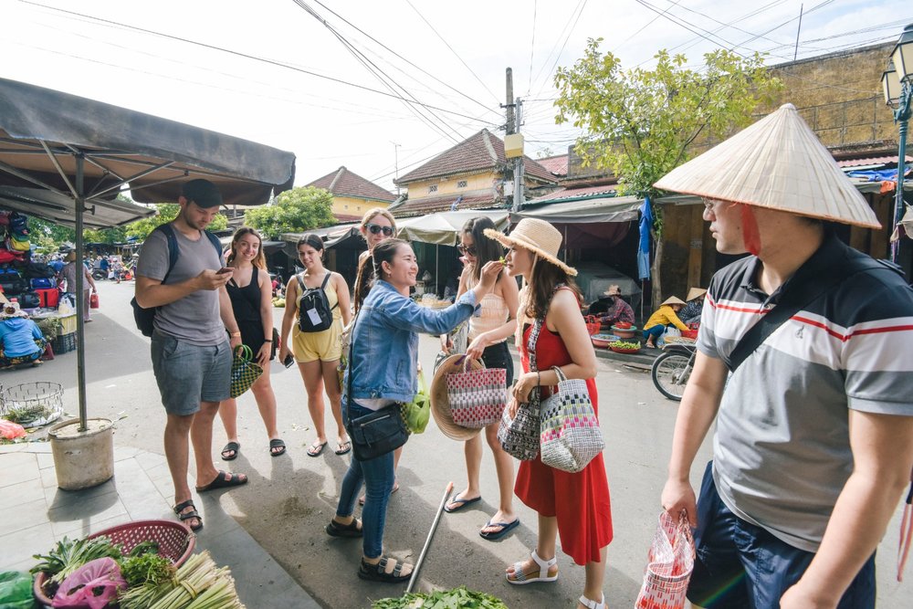 Tourists visiting Ba Le Market