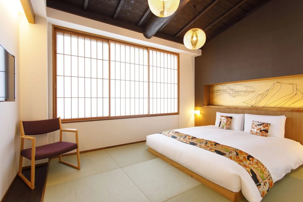 Elegant twin beds with wooden accents at Gion Misen Furumonzen Kyoto