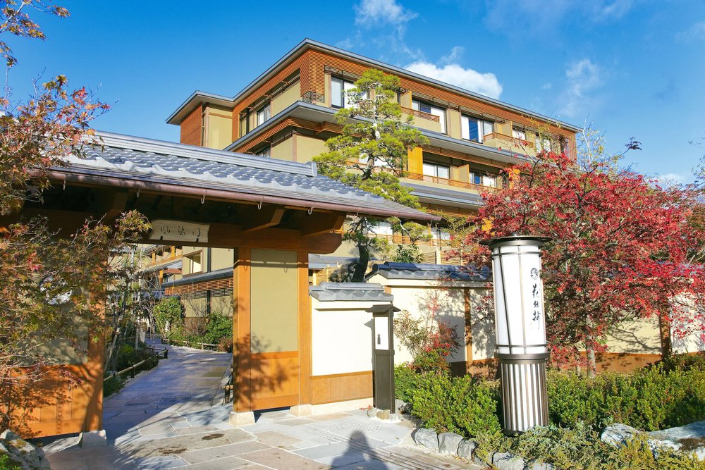 Classic Japanese inn with autumn foliage at Kadensho Arashiyama Onsen Kyoto