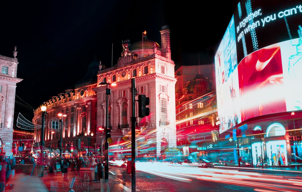 Piccadilly Circus at night with light trails and glowing billboards in London | Photo from Peter Spencer on Pexels