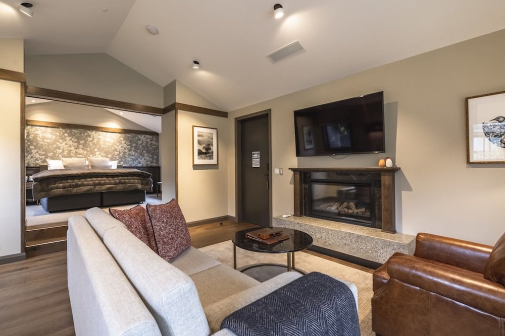 Elegant villa suite at Gibbston Valley Lodge & Spa with fireplace and separate bedroom