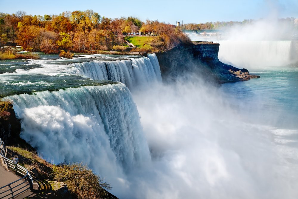 Powerful Niagara Falls flowing at peak spring season with heavy mist rising above the water