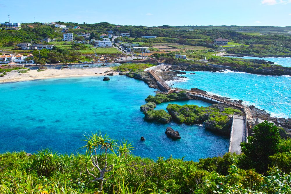 Okinawa coastline with wooden boardwalk and crystal clear sea