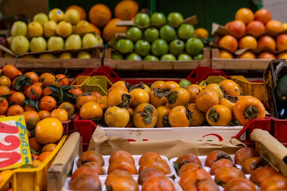 Crates of oranges and other fruits