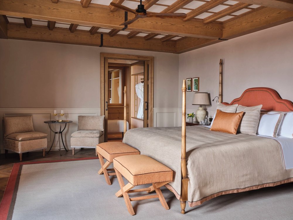 Elegant suite at Collegio alla Querce Florence with wooden beams and classic Italian design