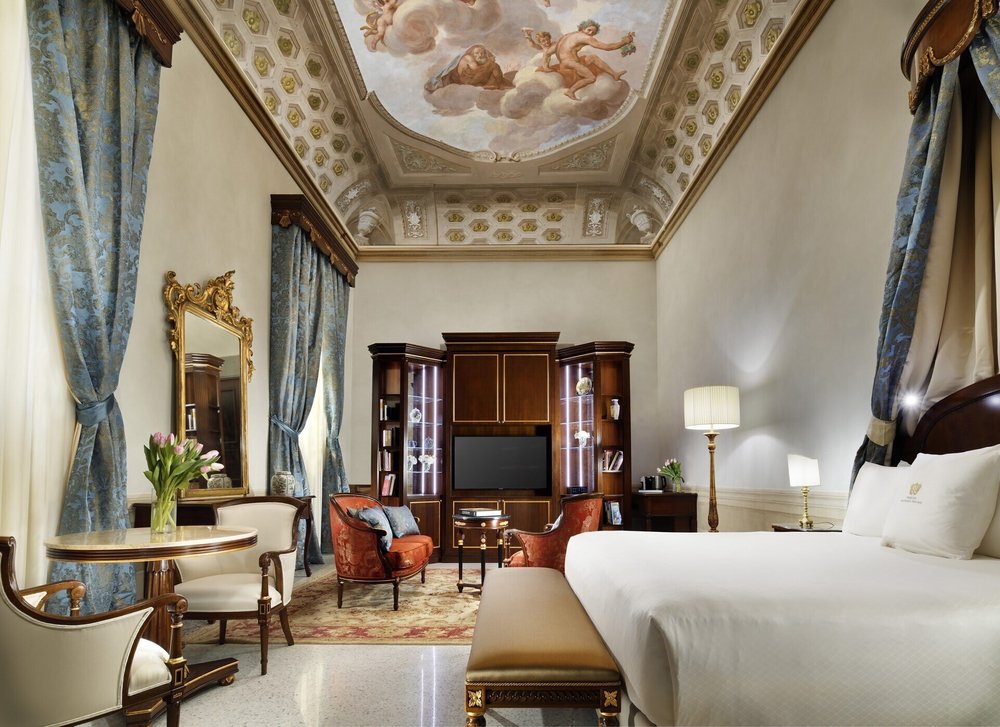 Luxury suite at Palazzo Portinari Salviati with ornate ceiling fresco and classic furnishings