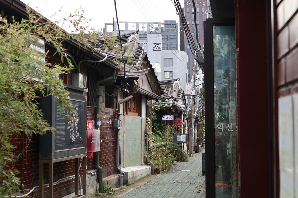 Ikseondong Hanok Village street with cafes and restored hanok houses