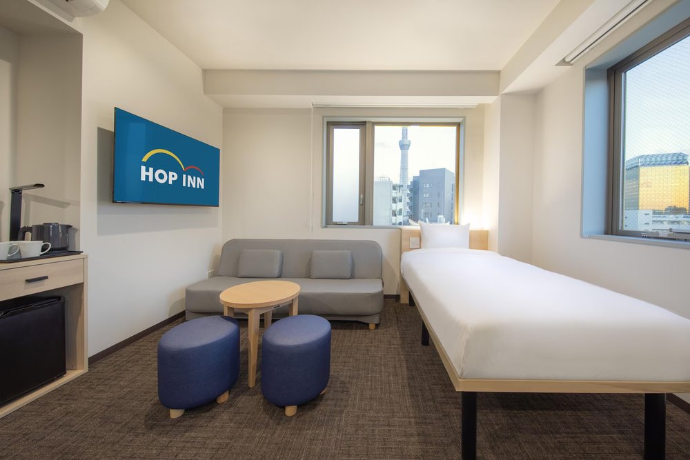 Modern budget hotel room at HOP INN Tokyo Asakusa with Tokyo Skytree view