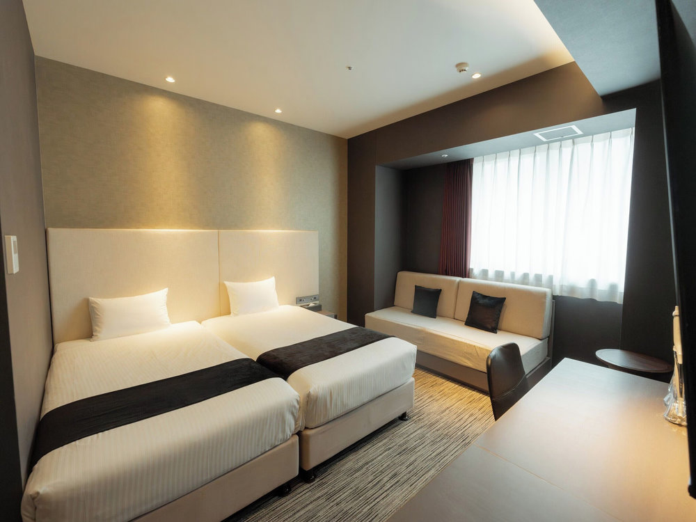 Contemporary hotel room at Hotel Aqua Citta Naha near Naha Port