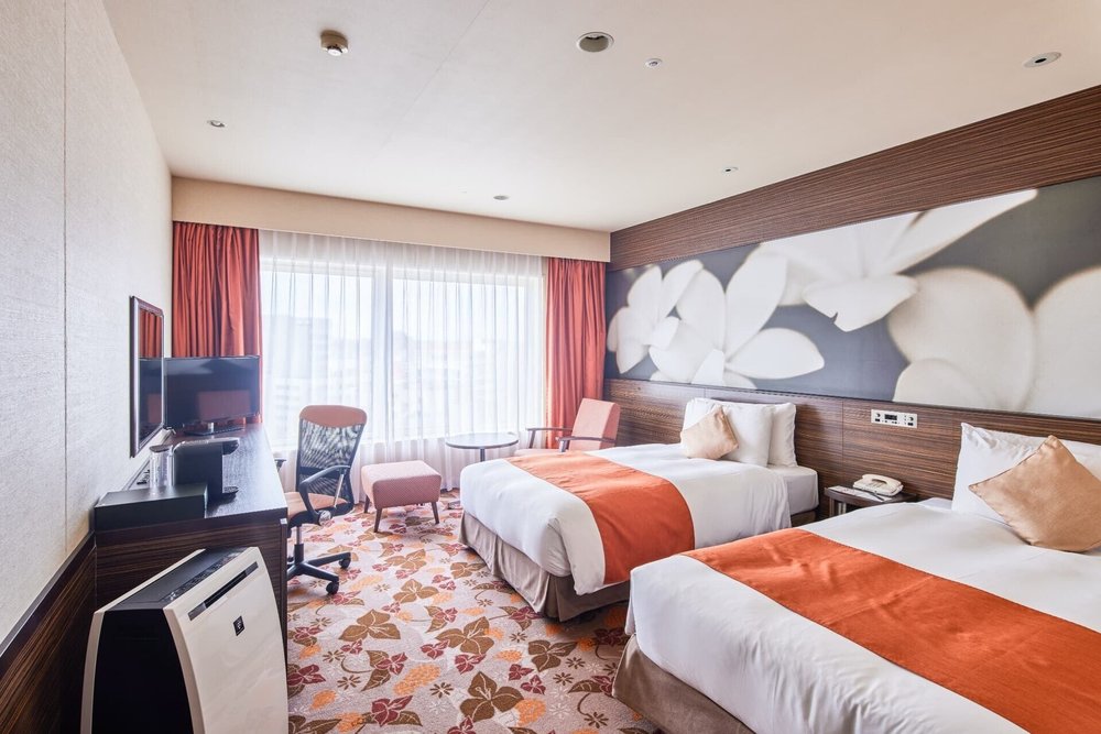 Comfortable hotel room interior at Okinawa NaHaNa Hotel and Spa