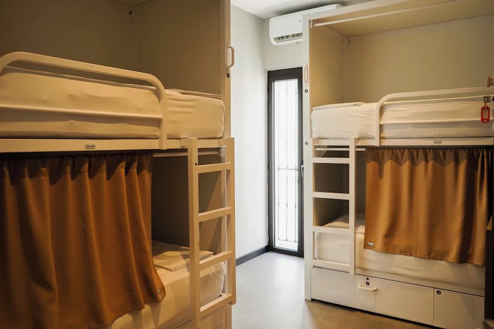 Modern bunk beds at Sweet Sevilla Hostel, a budget-friendly Seville hostel in the city center