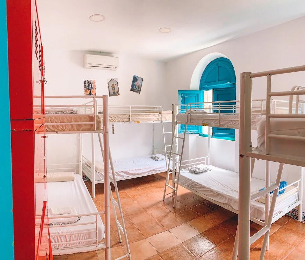 Bright dorm room at Rio Hostel, a colorful and social Seville hostel for backpackers