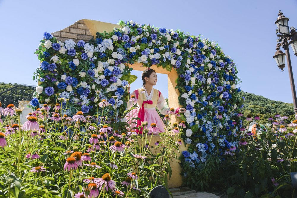 Visitor in traditional hanbok at Herb Island flower garden in Pocheon South Korea