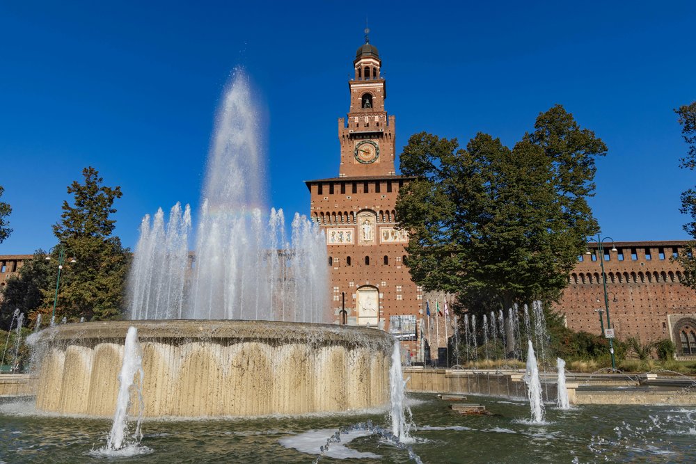 Sforza Castle with fountain in front located near Parco Sempione, Milan