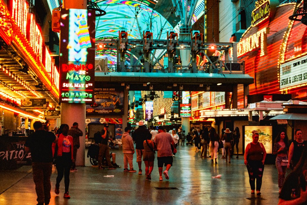 Crowds walking under the LED canopy at Fremont Street Experience in downtown Las Vegas