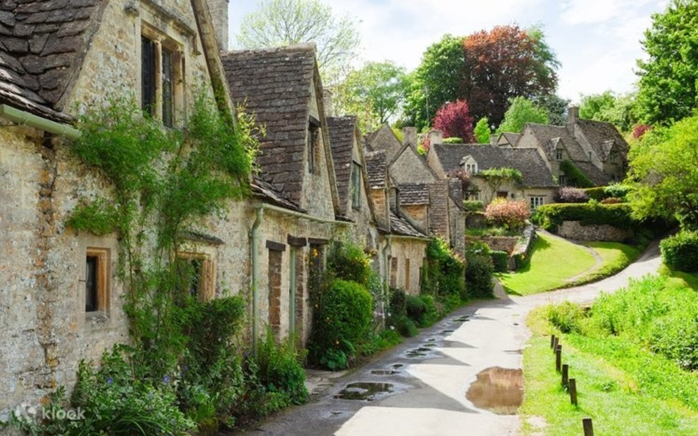 Old Cotswolds houses surrounded by greenery