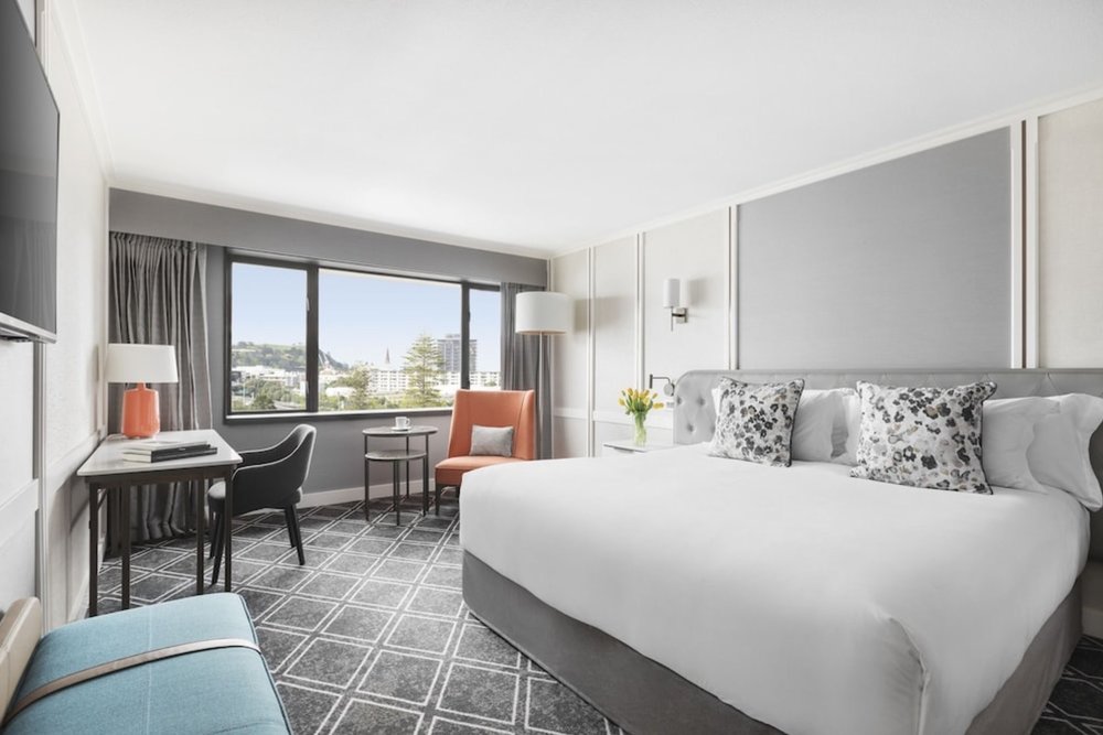 Elegant guest room at Cordis Auckland with city views and modern amenities