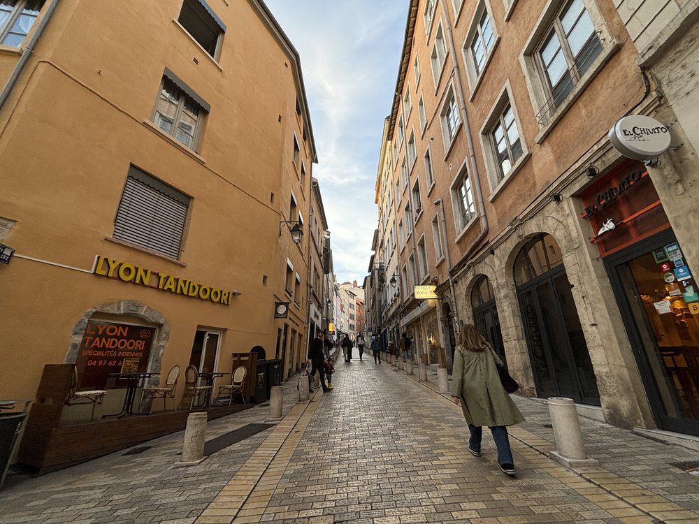 Charming cobblestone street in Vieux Lyon, one of the nicest cities in France for food lovers