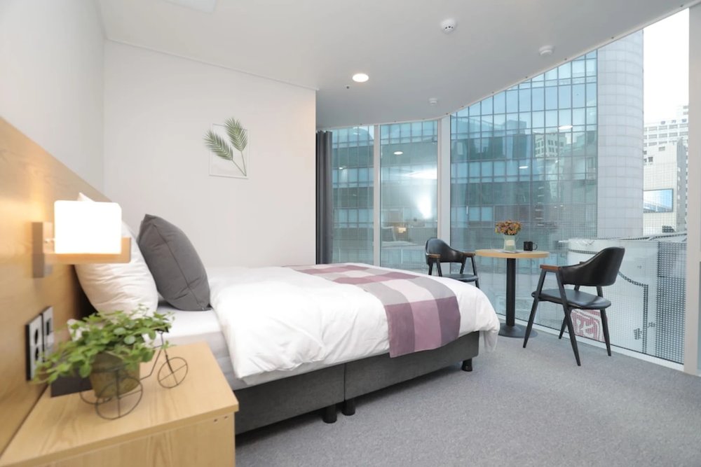Modern guest room with seating area at Line Hotel Myeongdong near Myeongdong Station