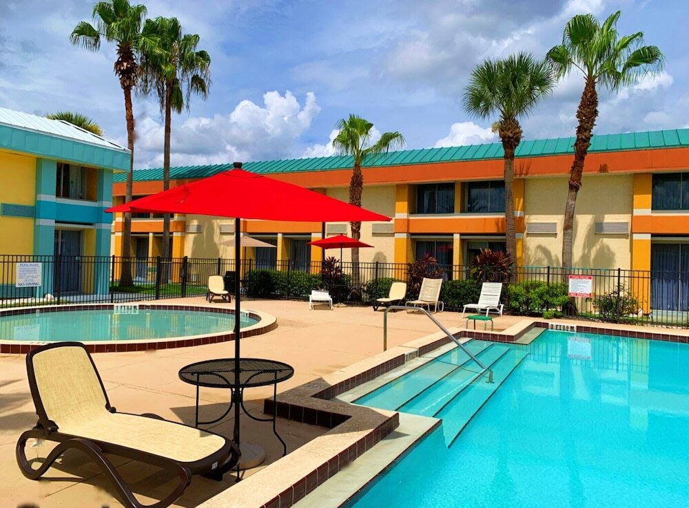 Bposhtels Orlando Florida Mall pool area with lounge chairs