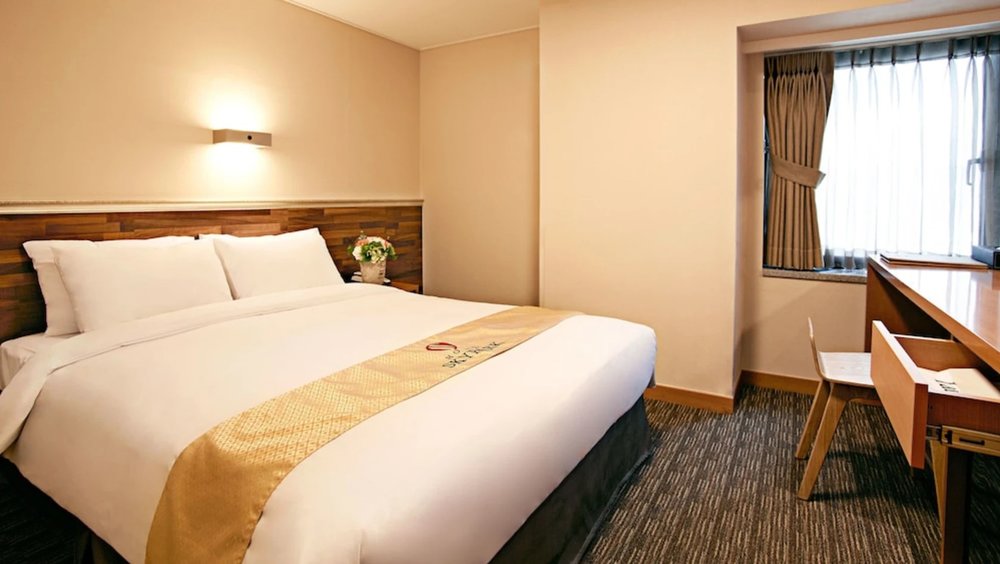 Cozy hotel room with work desk at Hotel Skypark Myeongdong in central Seoul